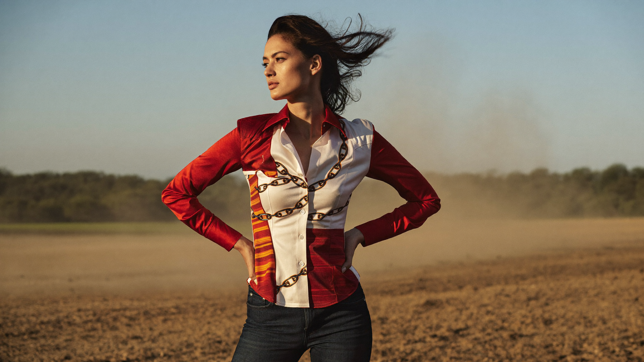 Golden hour western editorial with red and gold embroidered blouse