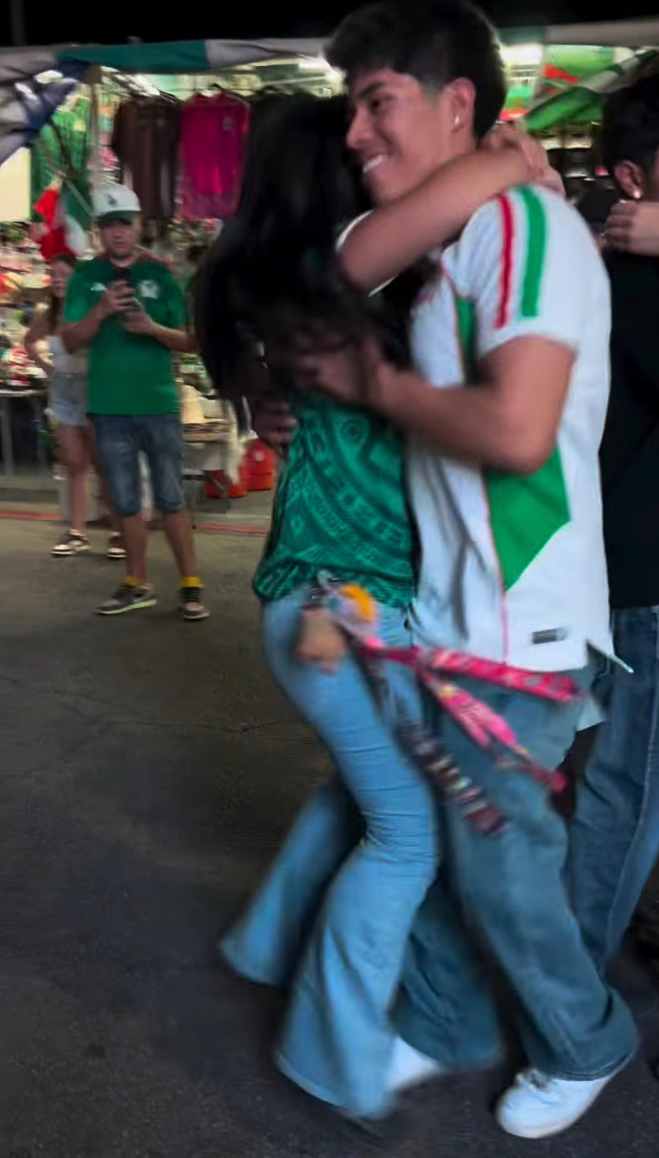 Young couple dancing huapango at a Latin cultural event