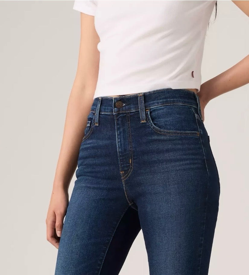 Levi's 720 high-rise super skinny women's jeans in dark wash, showing a close-up of the fitted style and denim texture.