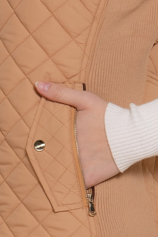 Active USA suede piping detail quilted padding vest featuring ribbed accents and outwear design, shown in a close-up view.