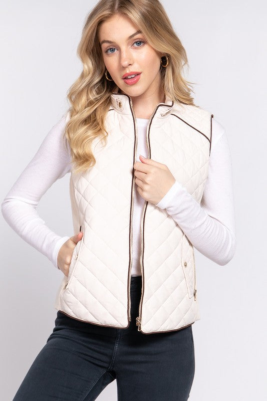 Active USA suede piping detail rib quilted padding vest showing quilted fabric, ribbed collar, and piping accents.