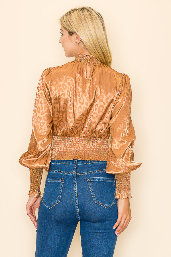 INA mock neck long sleeve top with fashionable animal print design, soft fabric, and fitted style for casual wear.