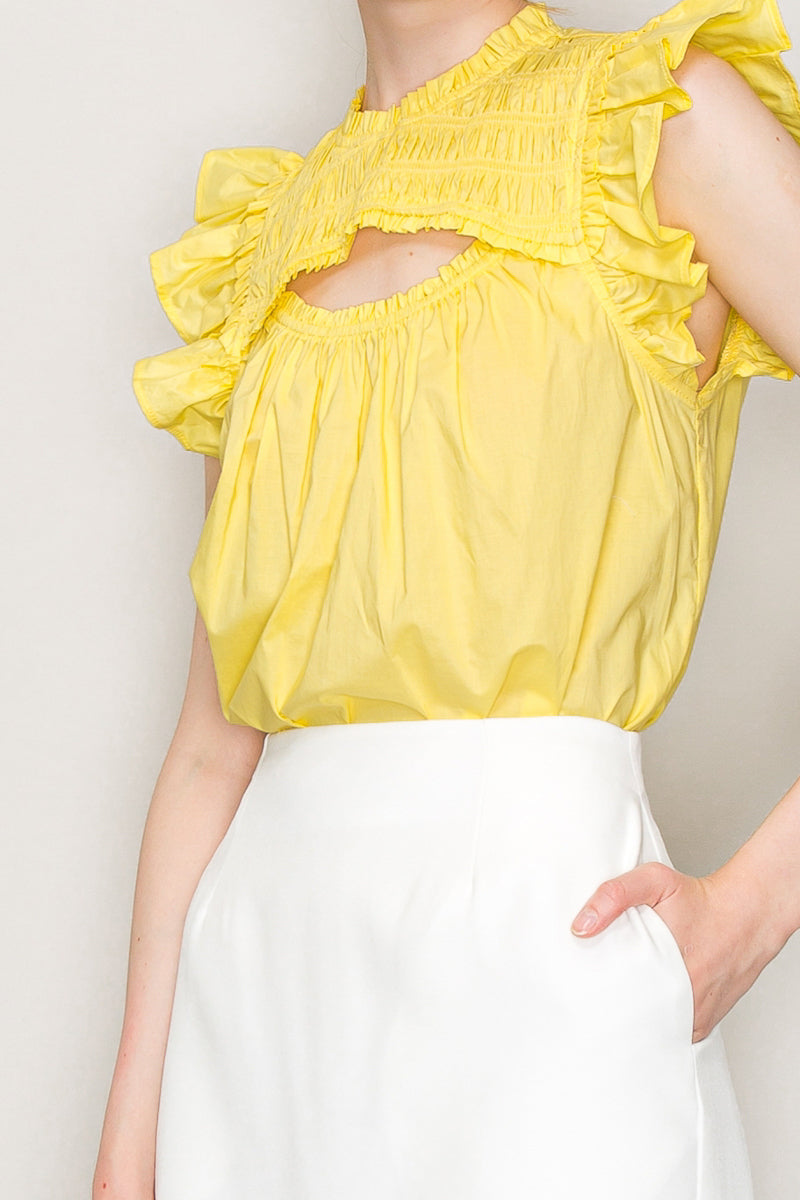 INA cut-out top with flutter sleeves, stylish women's blouse featuring a trendy cut-out design and flowy sleeve details.