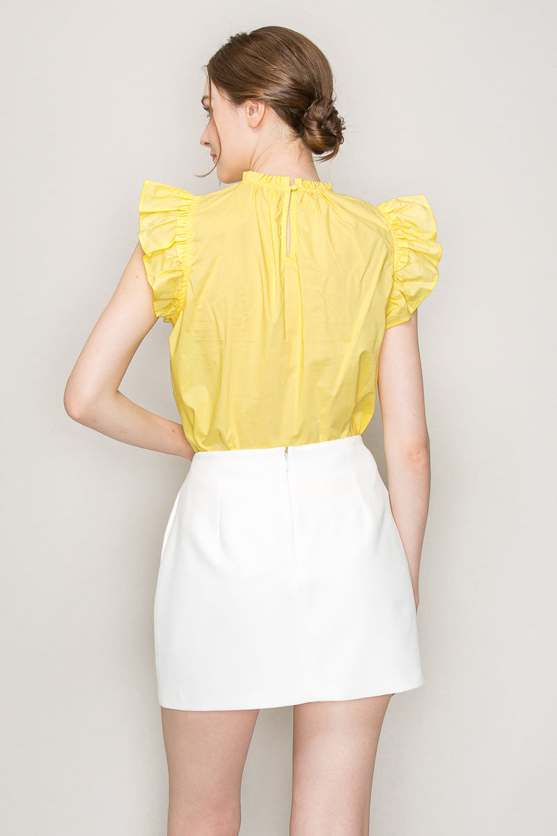 INA cut-out top with flutter sleeves, stylish sleeveless blouse featuring a cut-out detail and flowy, feminine design.