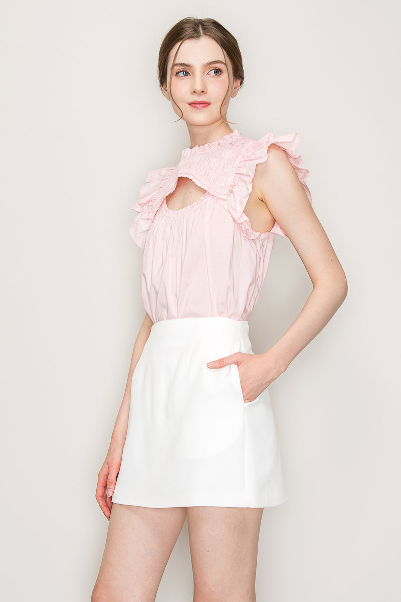 INA cut-out top with flutter sleeves, stylish sleeveless blouse featuring a side cut-out and flowy fabric, perfect for casual wear.
