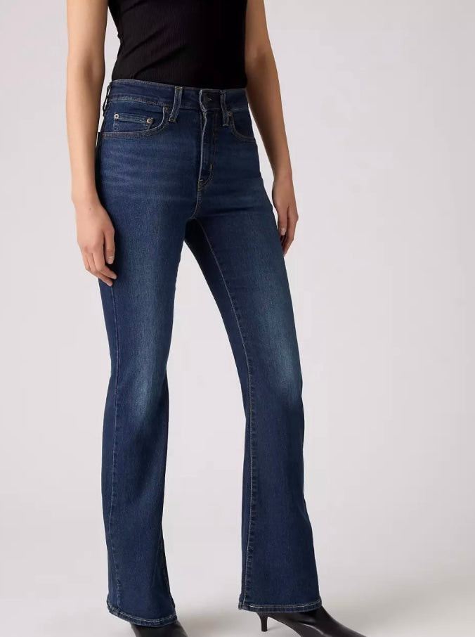 Bella Moda Latina 726 High Rise Flare jeans displayed on a model with a fitted waist and wide flare legs.