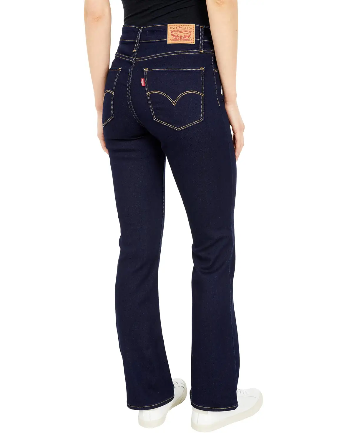 Levi's 725 High-Rise Boot Cut Jeans in dark wash with cast shadows, showcasing classic denim fit and stylish silhouette.