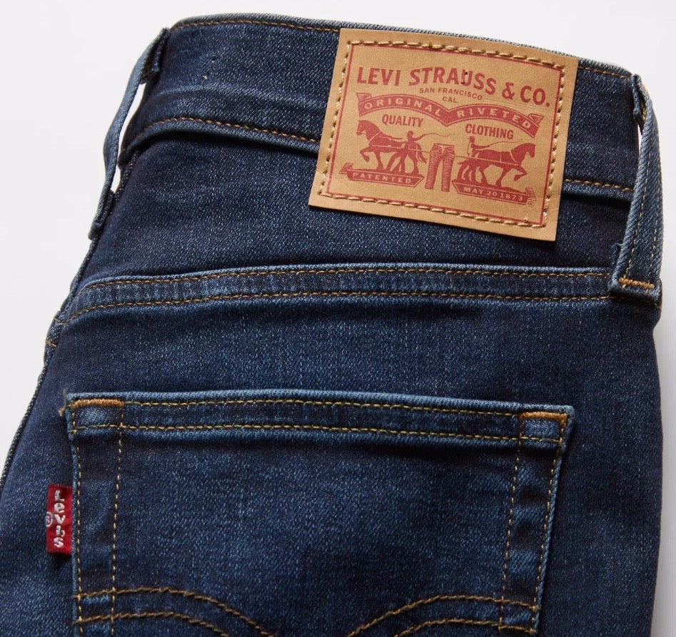Levi's 720 high rise super skinny women's jeans in dark denim, close-up of fitted style and stitching details.