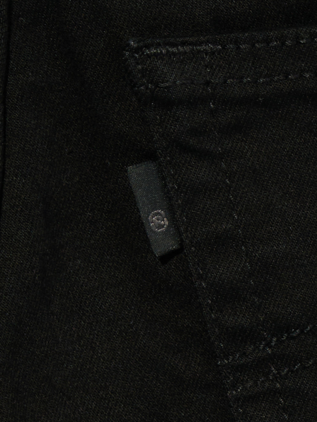Levi's 726 Soft Black jeans flared hem detail.