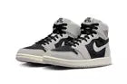 Women's Nike Jordan 1 Hi Zoom CMFT sneakers in Iron Ore color, featuring a high-top design with textured leather and stylish accents.