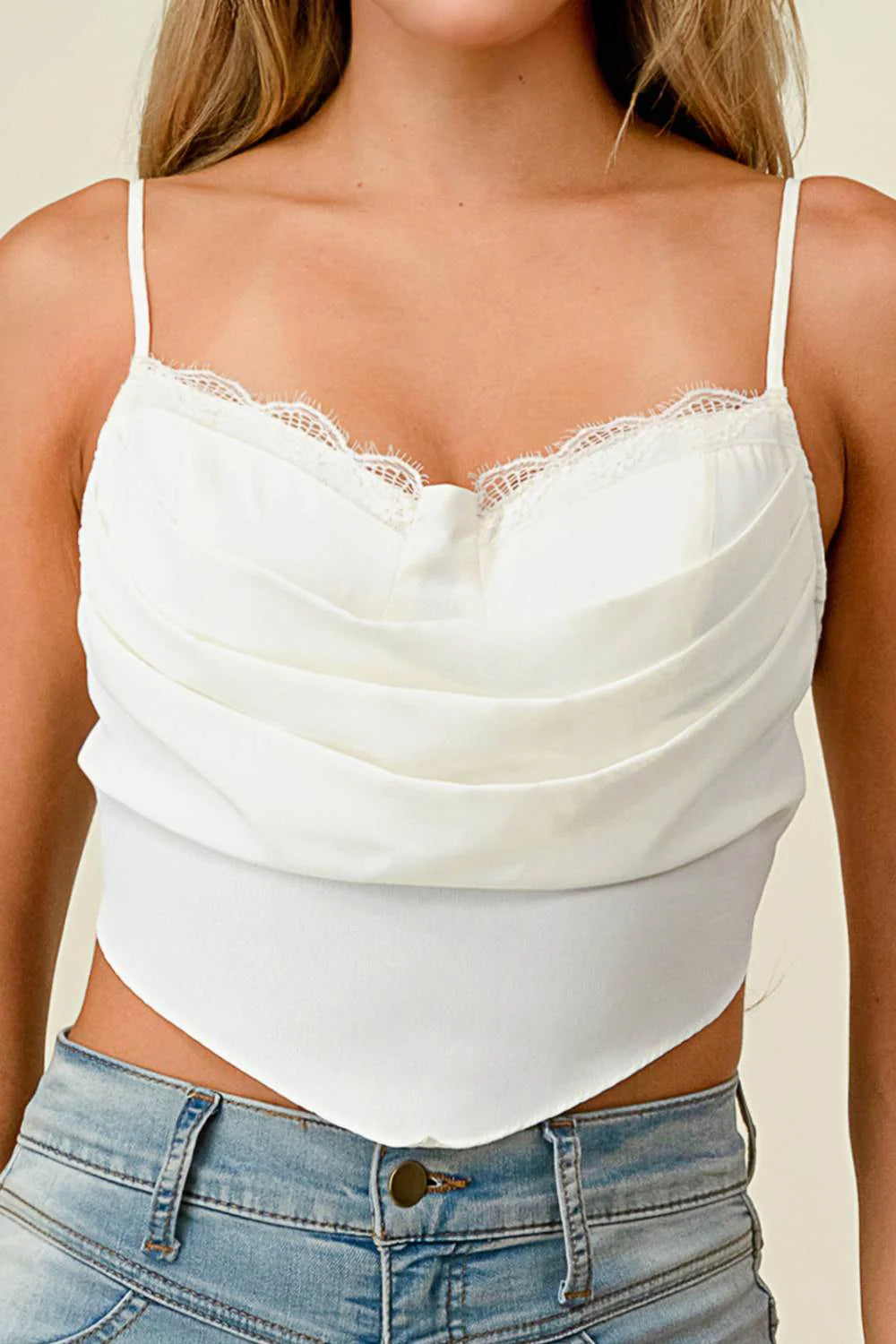 Black cowl neck back-tie cropped top by Privy, featuring a draped neckline and back tie detail, displayed on a mannequin.