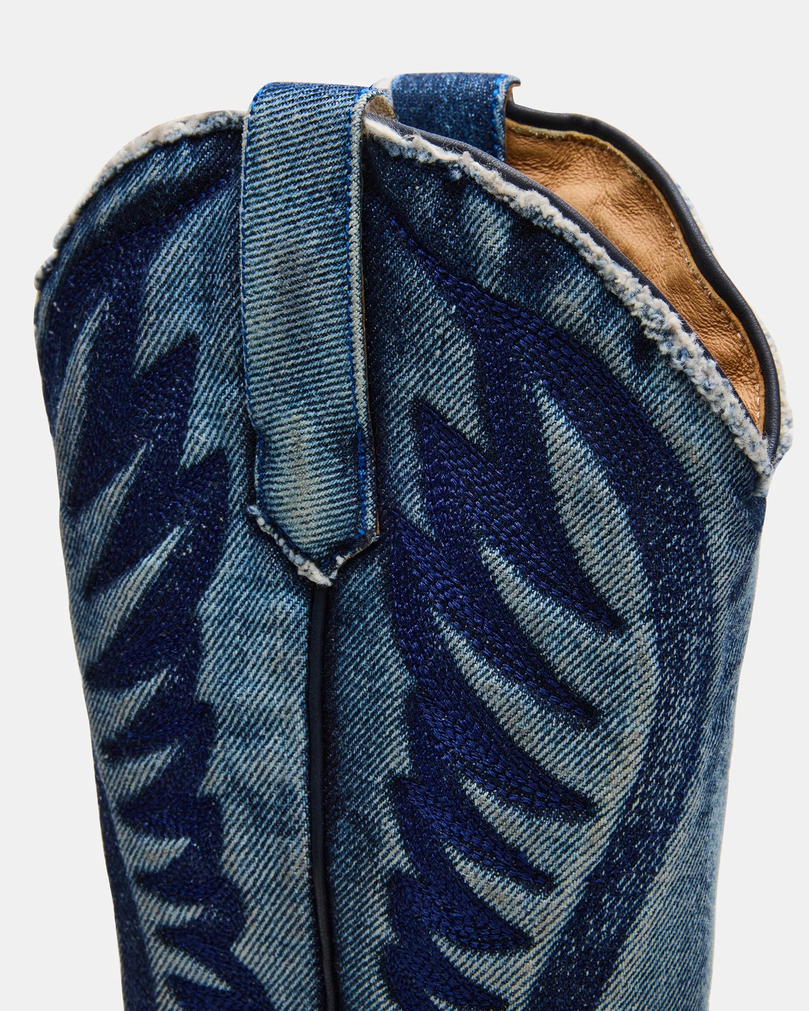 Steve Madden Albany Western boots featuring denim fabric, pointed toe, and low heel on a neutral background.