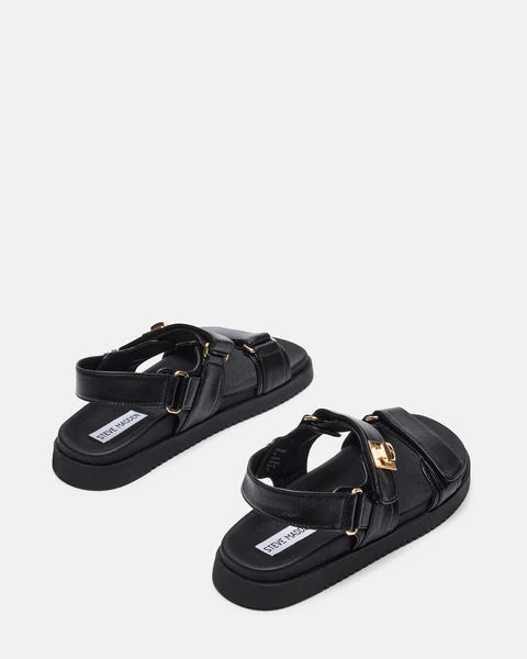 Black leather Steve Madden Mona sandals with open toes and ankle straps, stylish footwear for warm weather.