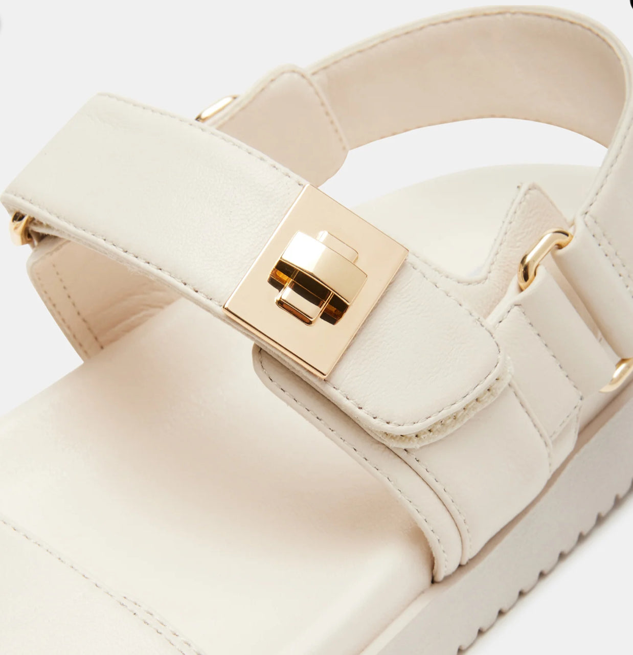 Steve Madden Mona leather sandals with open toes and ankle straps, featuring a sleek design and neutral color.