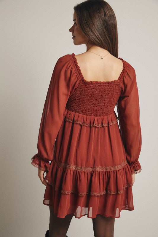 Crinkled tiered boho mini dress by Bella Moda Latina featuring flowy fabric and layered design for a stylish, relaxed look.