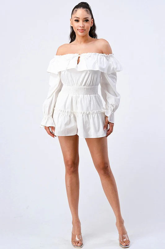 Off-shoulder ruffled layered puff sleeve romper by Bella Moda Latina in a stylish design with a vibrant color.