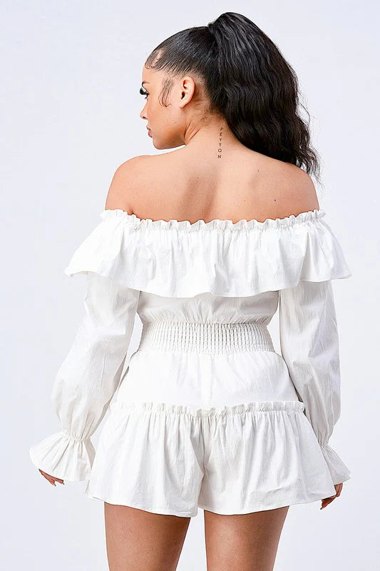 Bella Moda Latina off shoulder ruffled layered puff sleeve romper in a vibrant color, showcasing its stylish design and details.