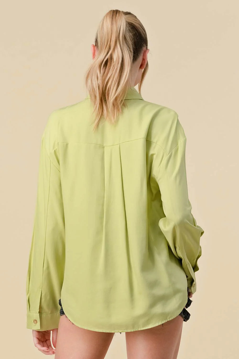 Long sleeve collared button-down shirt from Bella Moda Latina, featuring a classic design and lightweight fabric.