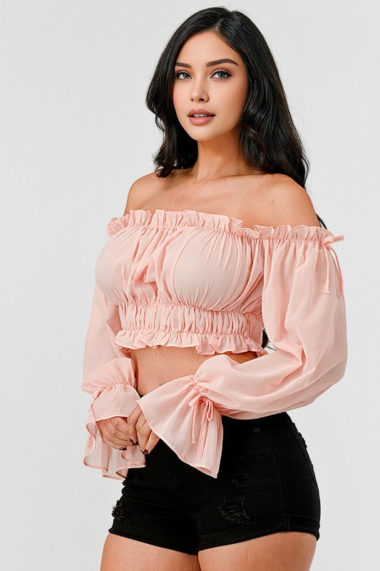 Off shoulder ruffle trim knot sleeve crop top by Bella Moda Latina, featuring a stylish off-shoulder design with ruffles and knot detail.