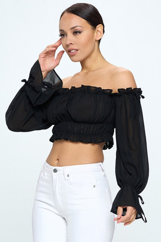 Off shoulder ruffle trim knot sleeve crop top by Bella Moda Latina, featuring fluttering ruffles and a stylish knot detail.