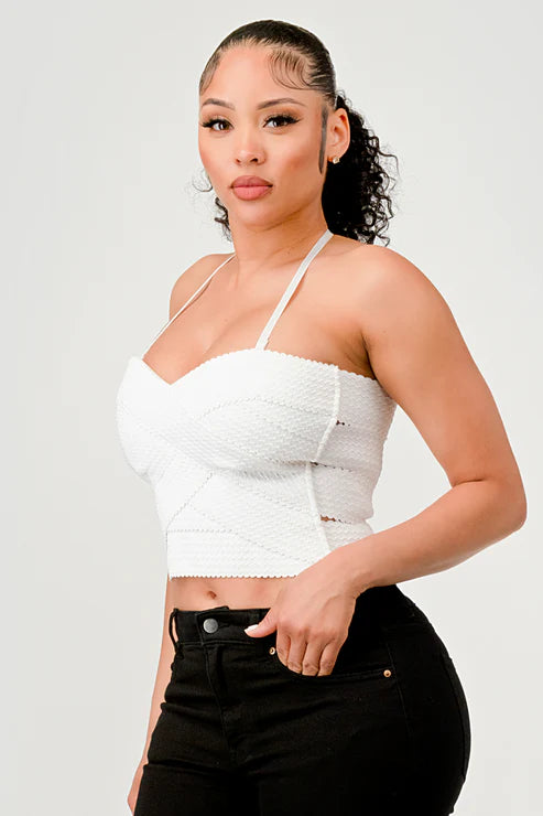 Bella Moda Latina zigzag bandage crop tube top, form-fitting sleeveless top with a bold zigzag pattern and strapless design.
