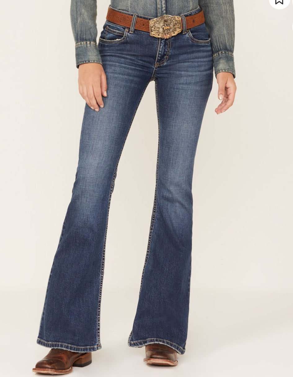 Wrangler Retro Bootcut Jeans displayed on a wooden surface, featuring a classic bootcut style and faded blue wash.