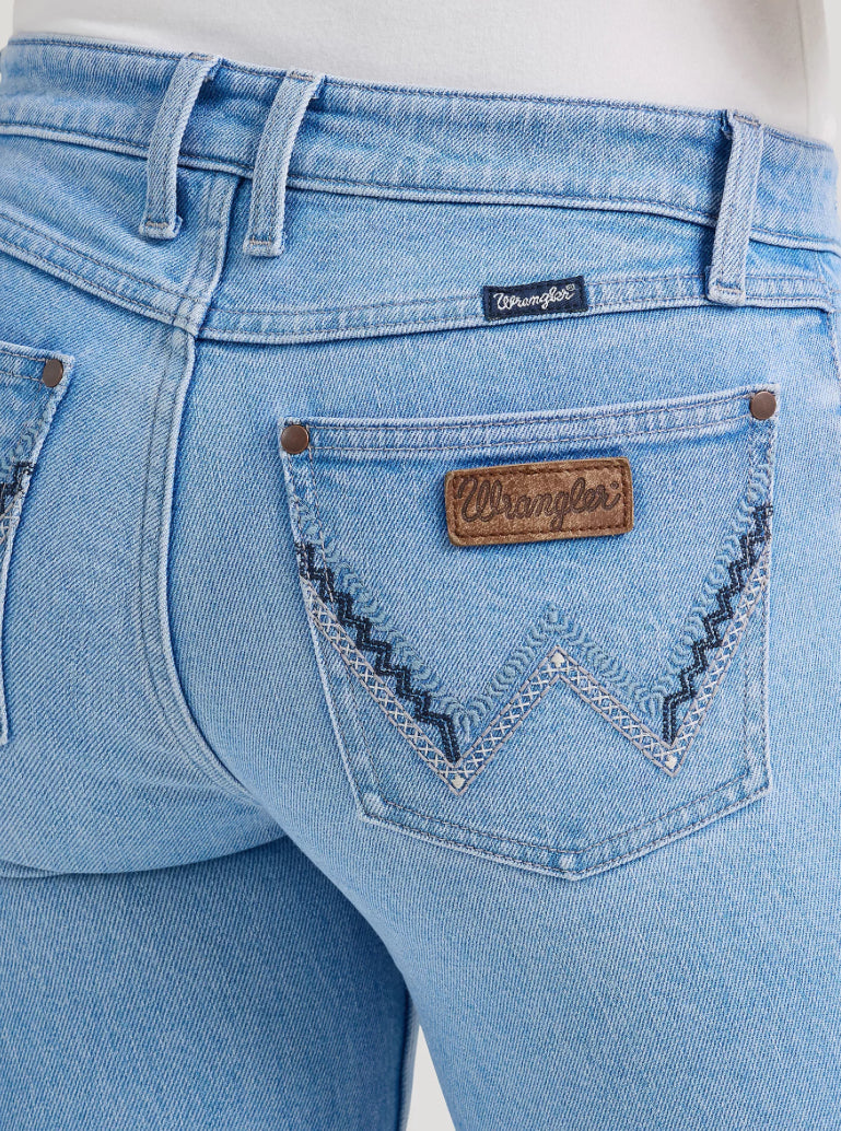 Wrangler Retro Bootcut Jeans in denim with a classic fit and stylish flared legs, displayed on a neutral background.