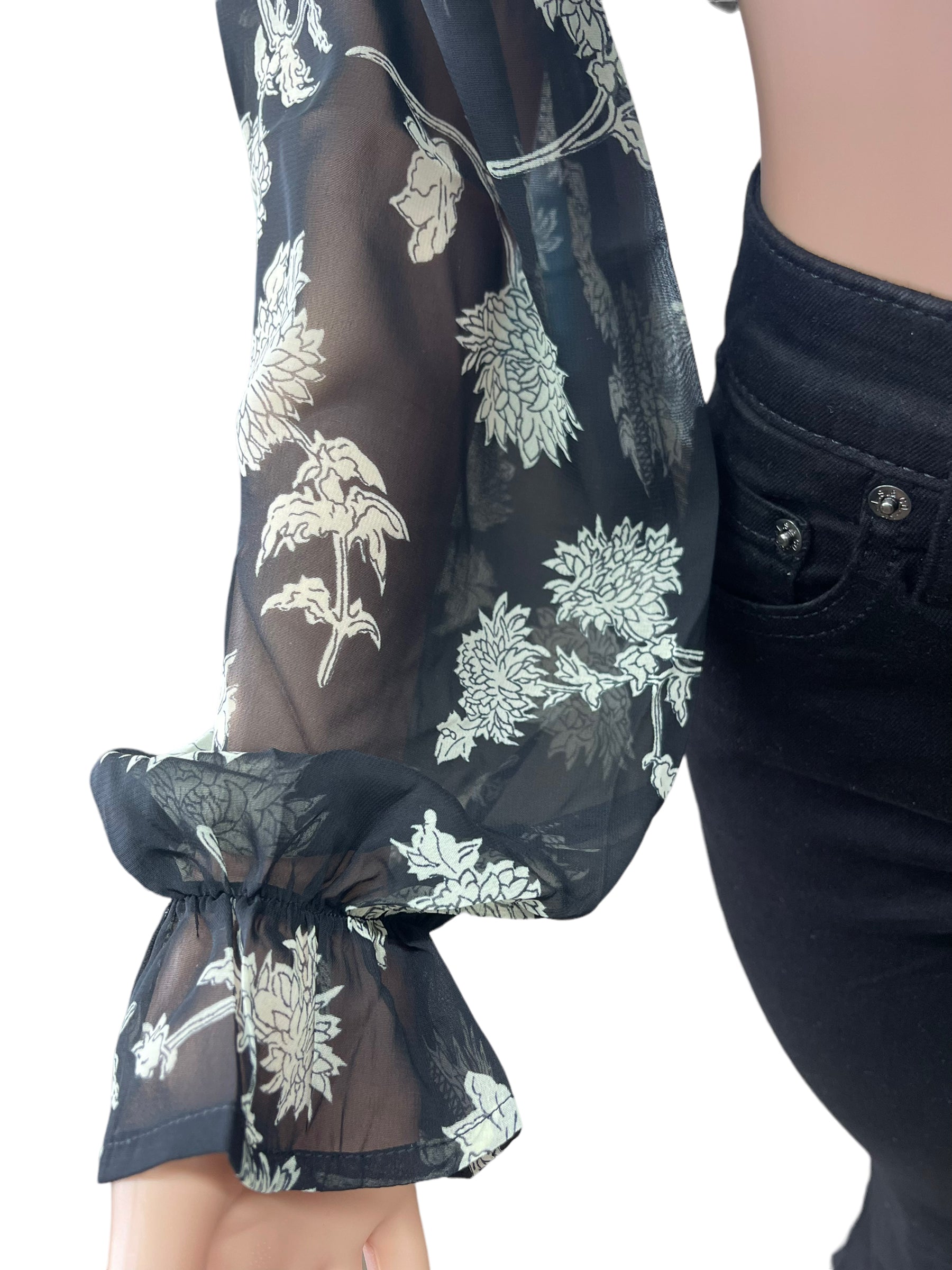 Rokoko chiffon top featuring lightweight, flowy fabric and a feminine design, styled with long sleeves and a relaxed fit.