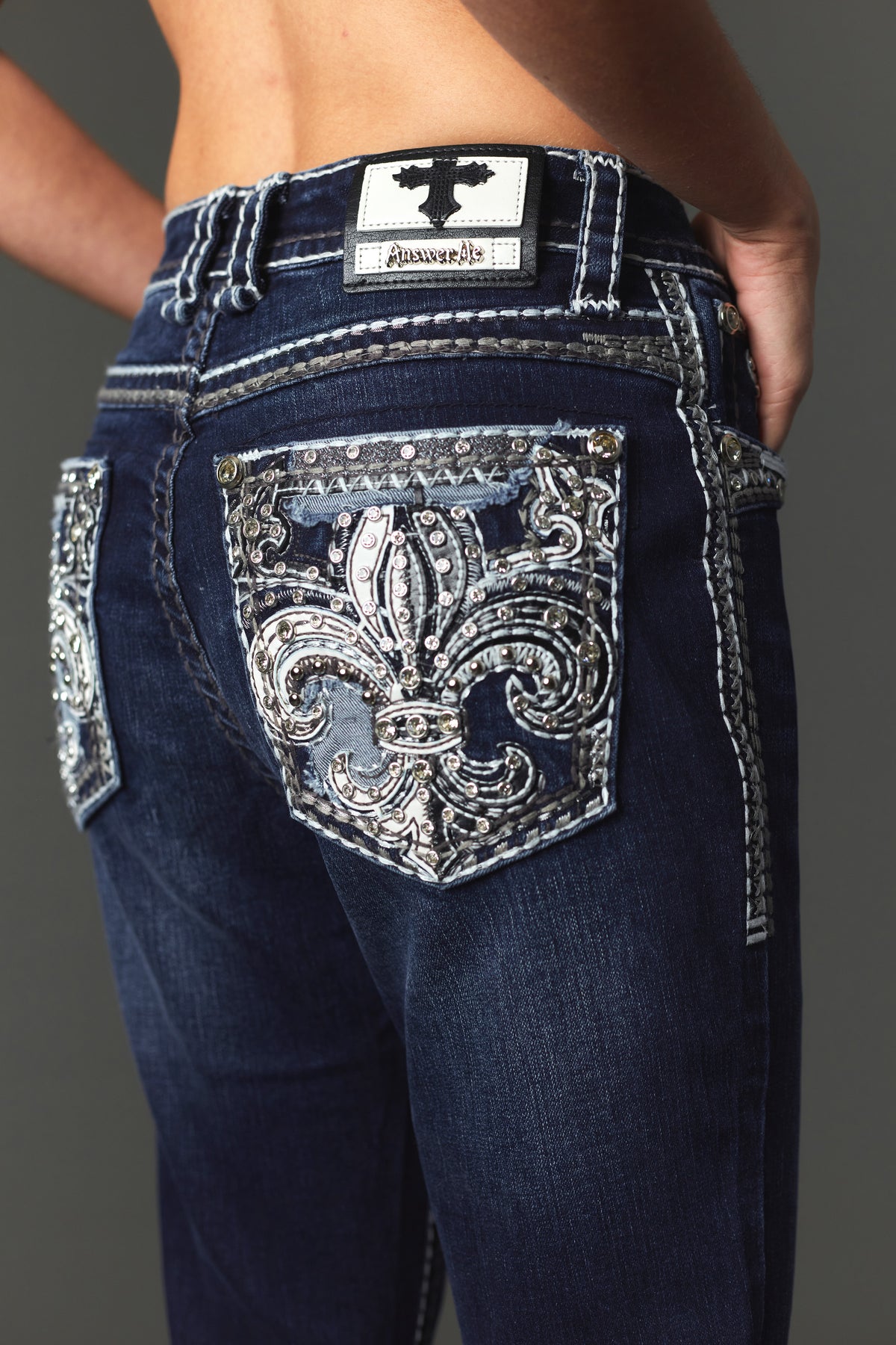 Back pocket fleur-de-lis embroidery detail on Answer Me A1145 jeans