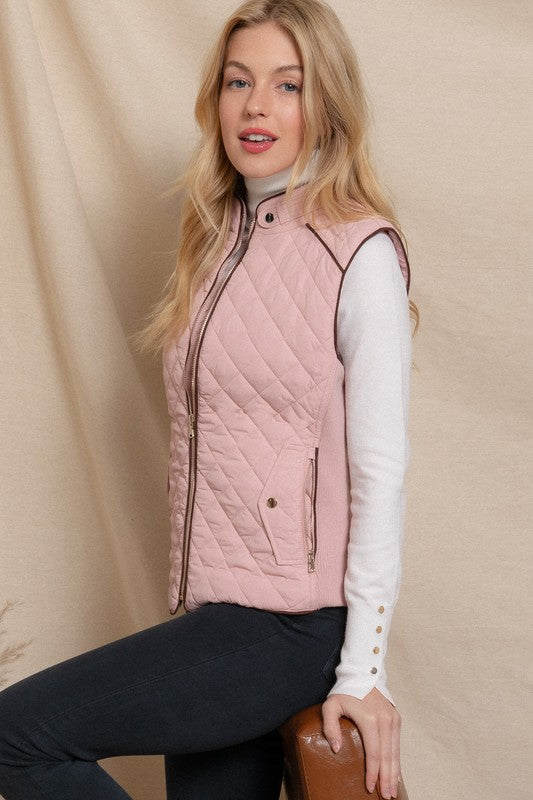 Active USA suede piping detail quilted padding vest with ribbed accents, outwear for cold weather, shown in a close-up view.