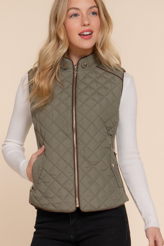 Active USA suede piping detail quilted padding vest, outwear with ribbed design and quilted texture, shown in a close-up shot.