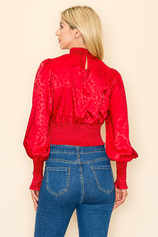 INA mock neck long sleeves top with stylish animal print fabric, perfect for casual or trendy outfits.