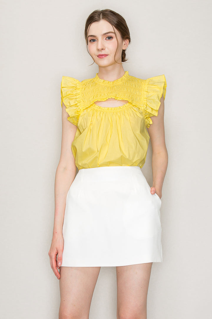 INA cut-out top with flutter sleeves, stylish sleeveless blouse featuring a cut-out detail and flowy sleeve design.