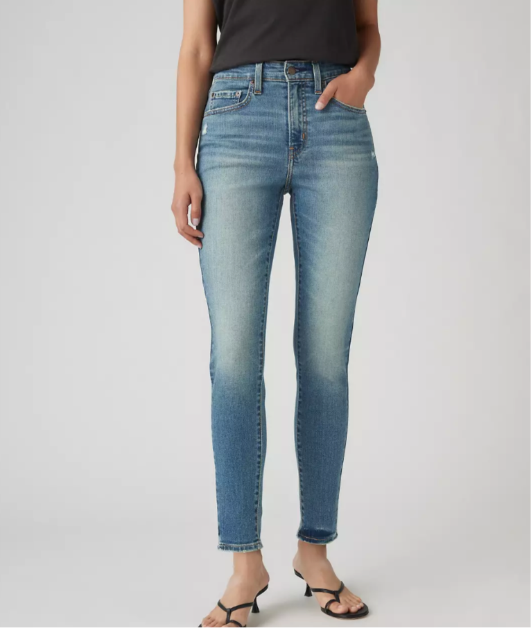 Levi's 721 high-rise skinny jeans in classic blue denim, fitted style with front and back pockets.