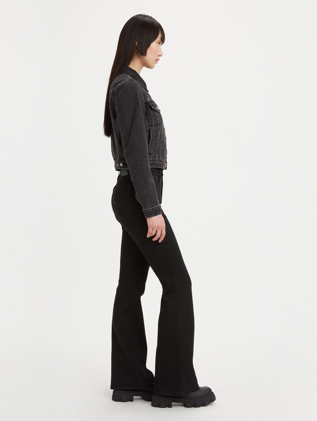 Levi's 726 high-rise flare jeans in Soft Black, side view on model.