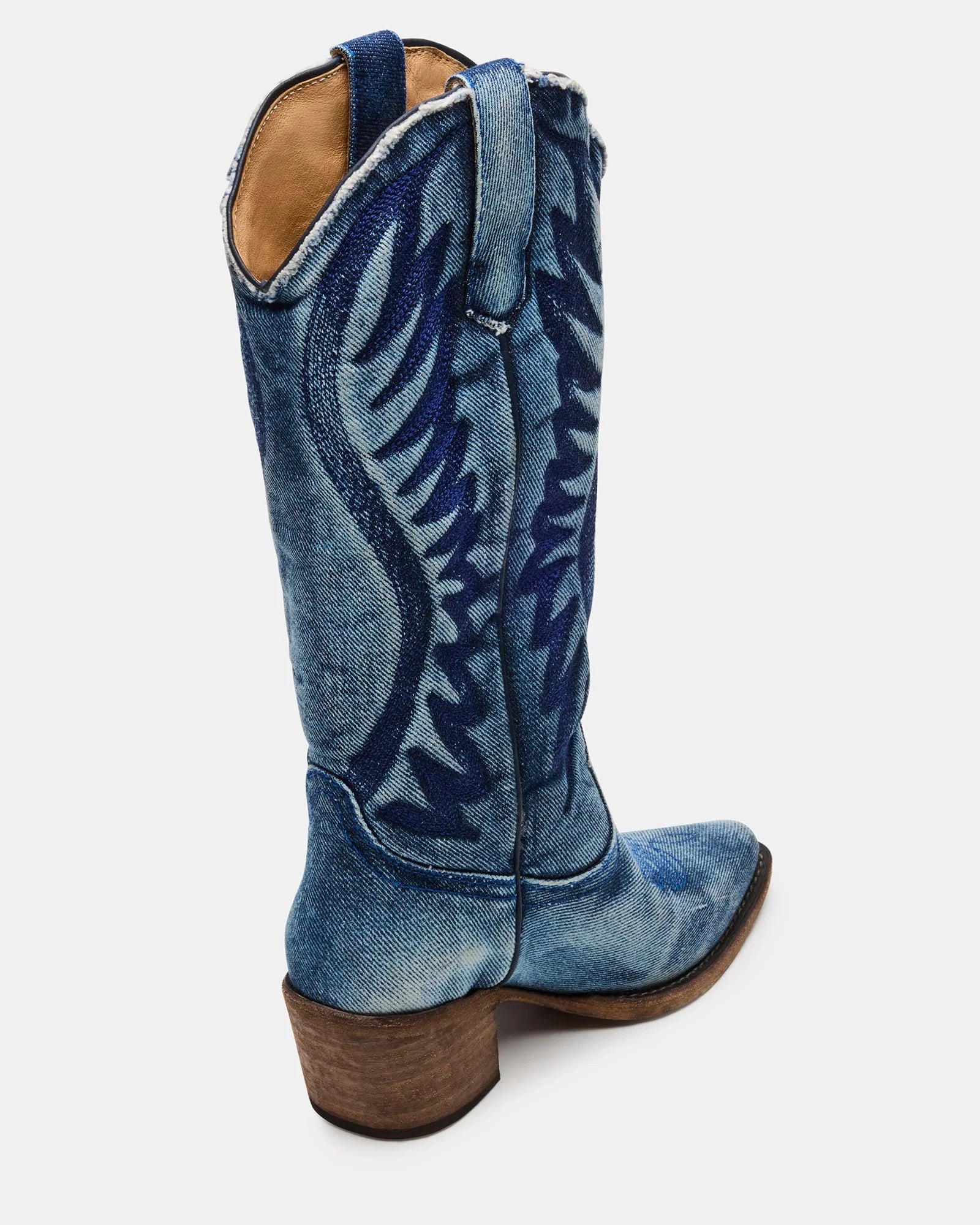 Steve Madden Albany denim fabric Western boots with pointed toes and decorative stitching on a neutral background.