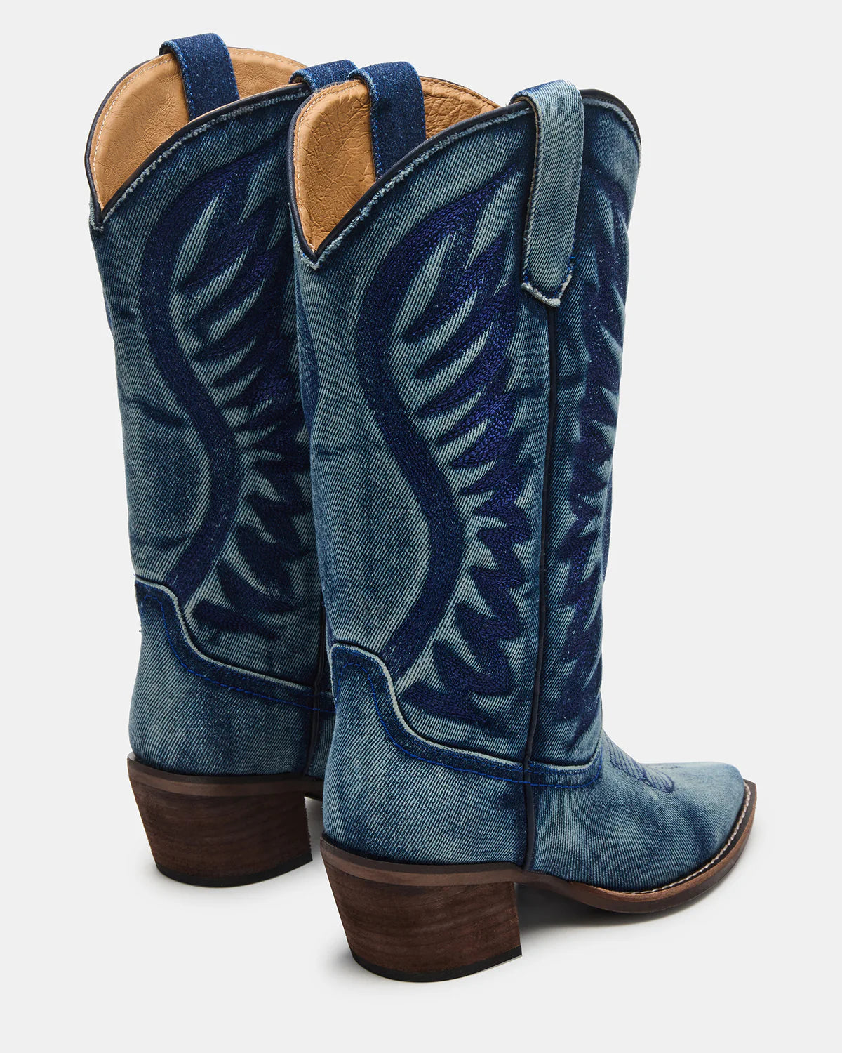 Steve Madden Albany denim fabric western boots with pointed toes and stacked heels displayed on a neutral background.