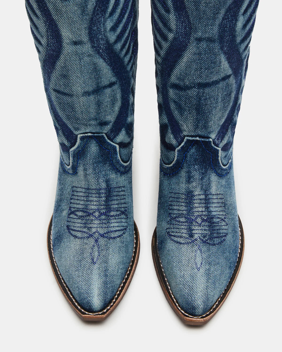 Steve Madden Albany denim fabric western boots featuring classic Western silhouette and stylish denim material.