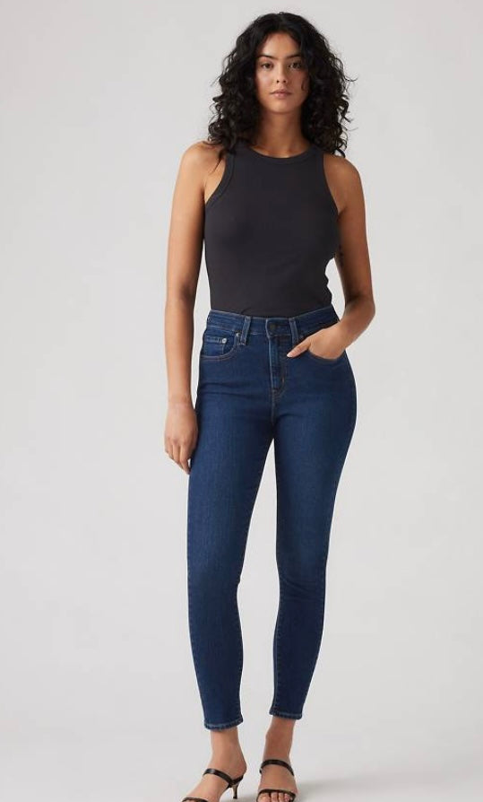 Levi’s 721 High Rise Skinny jeans in classic denim, displayed on a hanger with a natural fit and modern silhouette.