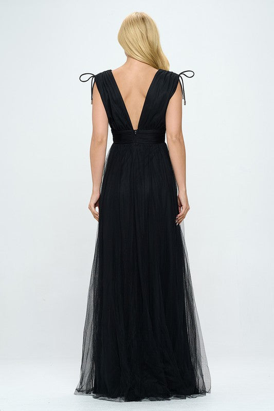 Bella Moda Latina plunging neckline layered tulle maxi dress, elegant evening gown with flowing fabric and deep V neckline.