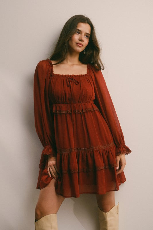 Crinkled tiered boho mini dress by Bella Moda Latina with flowy fabric and layered design, perfect for casual summer wear.