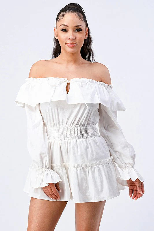 Bella Moda Latina off shoulder ruffled layered romper with puff sleeves in a stylish design and vibrant color.
