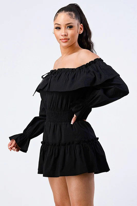 Off shoulder ruffled layered puff sleeve romper by Bella Moda Latina in a stylish design and vibrant color.