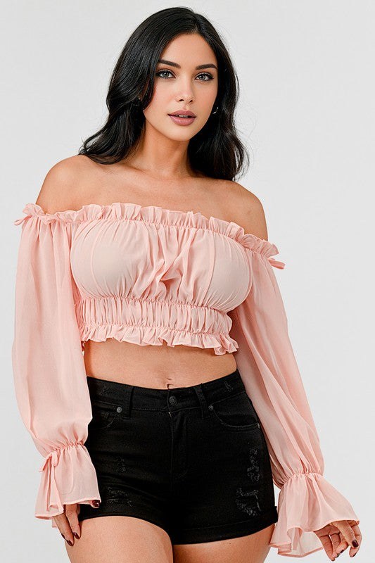 Off-shoulder ruffle trim knot sleeve crop top by Bella Moda Latina, featuring a stylish neckline and ruffle details.