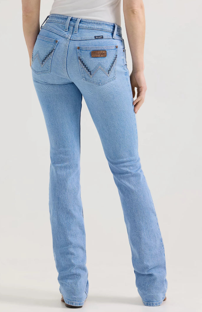 Wrangler Retro Bootcut Jeans in blue denim with a classic fit and subtle fading, displayed on a neutral background.