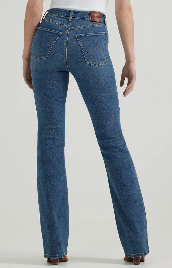 Wrangler bootcut jeans in classic denim with a relaxed fit and subtle fading, displayed full-length on a plain background.