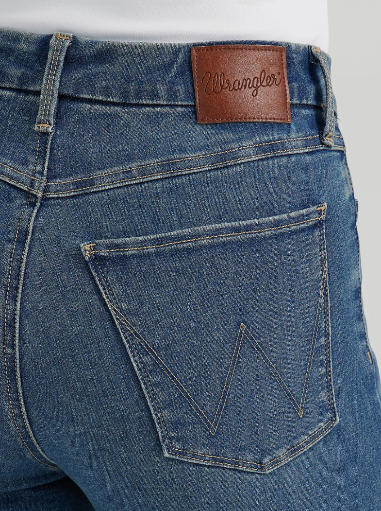 Wrangler Bootcut Jeans displayed on a hanger, showing classic denim fabric and relaxed fit style.